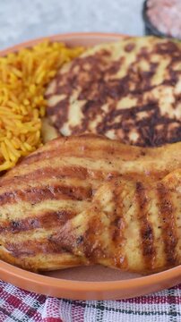 Dajaj Mashwi, an Arabic dish with rice and chicken, salt, and spices. Dajaj Mashwi as a food background for your design