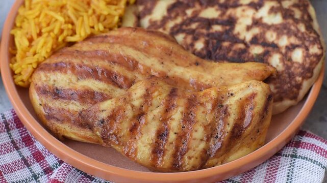 Dajaj Mashwi, an Arabic dish with rice and chicken, salt, and spices. Dajaj Mashwi as a food background for your design