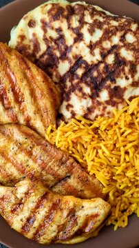 Dajaj Mashwi, an Arabic dish with rice and chicken, salt, and spices. Dajaj Mashwi as a food background for your design