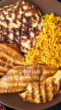 Dajaj Mashwi, an Arabic dish with rice and chicken, salt, and spices. Dajaj Mashwi as a food background for your design