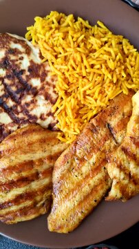 Dajaj Mashwi, an Arabic dish with rice and chicken, salt, and spices. Dajaj Mashwi as a food background for your design