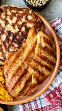 Dajaj Mashwi, an Arabic dish with rice and chicken, salt, and spices. Dajaj Mashwi as a food background for your design