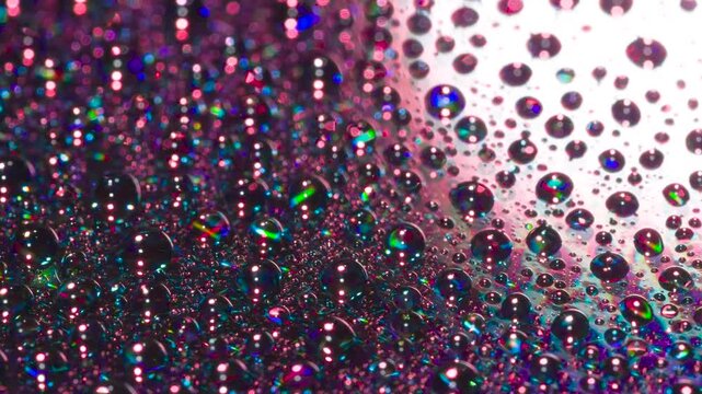 Process of Crystal Structure Formation. A mirror surface with drops of a chemical composition applied to it slowly rotates in laser beams of varying frequencies