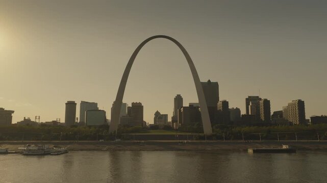 An aerial shot past the gateway Arch in late afternoon, St. Louis, MO