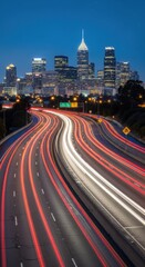 Fototapeta premium Dynamic Cityscape Illuminated By Streaking Headlight Trails At Dusk