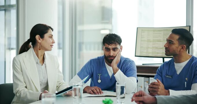 Doctors, meeting and man with fatigue, tired and depression with mental health, anxiety and overworked. People, medical and professional with stress, mistake and burnout with schedule or exhausted