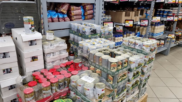 Canned food and olives bulk display in supermarket, grocery retail stock