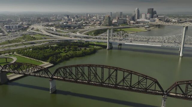An aerial flyover of the Ohio river and Big Four Bridge approaching Louisville, KY