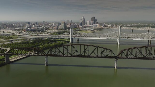 An aerial flyover of the Ohio river and Big Four Bridge approaching Louisville, KY