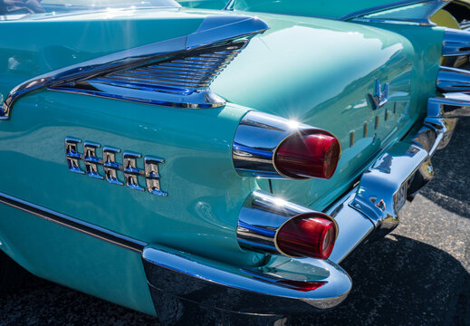 Georgetown, TX - 28 February 2026: Rocket taillights of a Dodge Custom Royal turquoise car at car rally