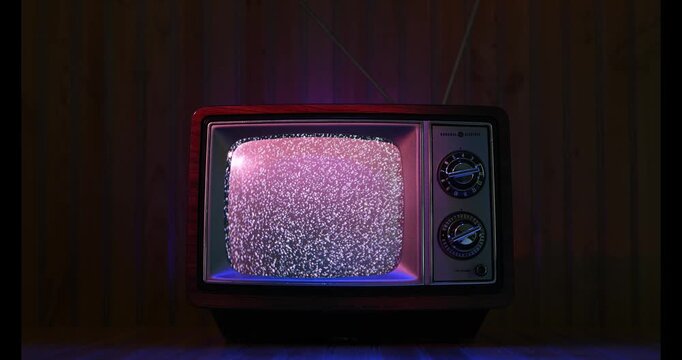 Analog Retro TV displaying static on Wood Paneling Background and Surface Atmosphere 