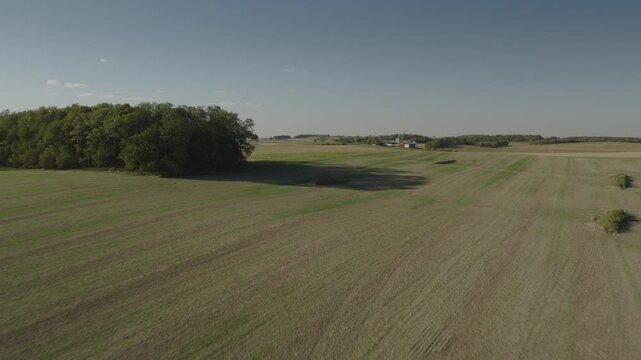 An Aerial flyover farmland and woods near Tower Hill, IL
