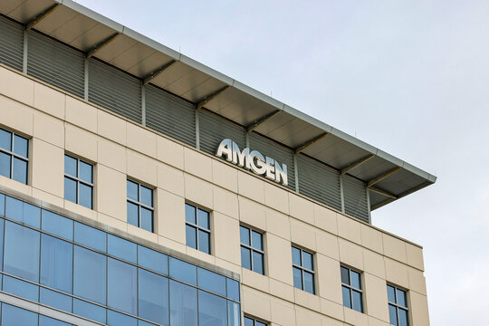 Cambridge, Massachusetts, USA &ndash; Amgen logo on the exterior of a biotechnology company office building in the Kendall Square life sciences district