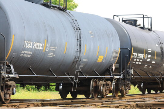 Railroad freight cars hauling compressed toxic gasses