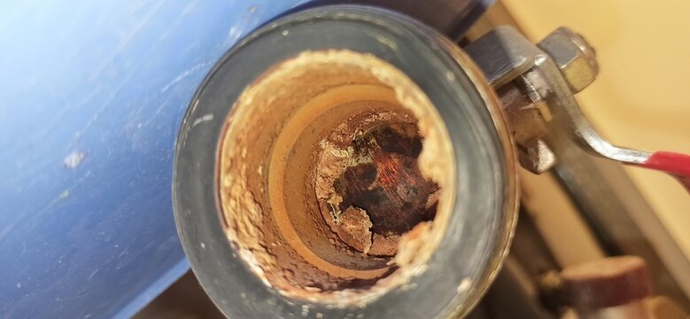 rust inside the pipe/boiler. Severe corrosion inside the metal pipe or water heater, metal destruction, deposits and scale.