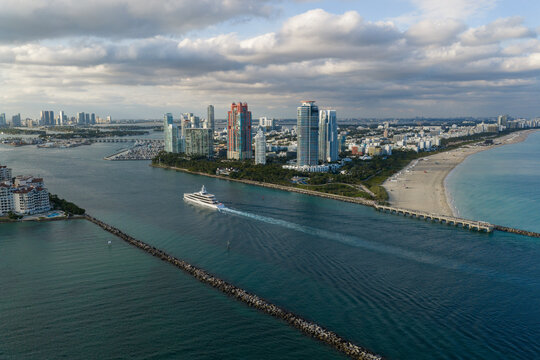 Miami south beach view. Yacht boat tour. Luxury boat yachting. Luxury yacht in sea. Aerial view motorboat. Luxury lifestyle. Vacation on summer. Yacht at sea. Motorboat aerial top view
