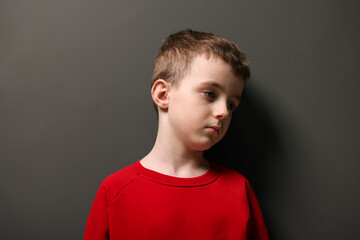 Fototapeta premium Autism. Little boy with ASD on black background