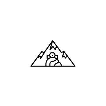 Penguin in front of mountain range.