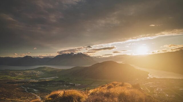 A timelapse Slider Shot at Sunset Revealing Lake Wakatipu Valley from Above Queenstown New Zealand
