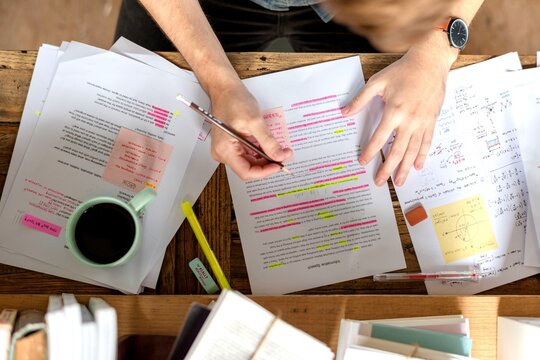 Studying notes with coffee mug