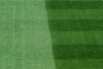 Background Texture of International-Standard Football Pitch with Striped Grass and Field Lines Under Clear Conditions © minortica7