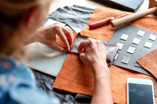 Artisan crafting leather goods photo
