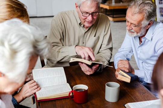 Elderly group reading together photo