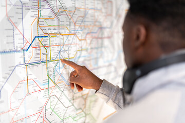 Person analyzing complex map.