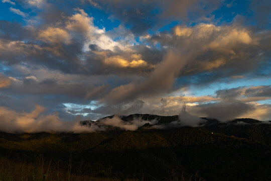 Cityscape View from Waraira Repano Mountains at Dusk. Panoramic view of the urban horizon at sunset, captured from the high-altitude trekking trails of Guatire, Miranda, Venezuela. South America