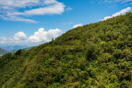 Green mountain slope with chicamocha canyon cable car