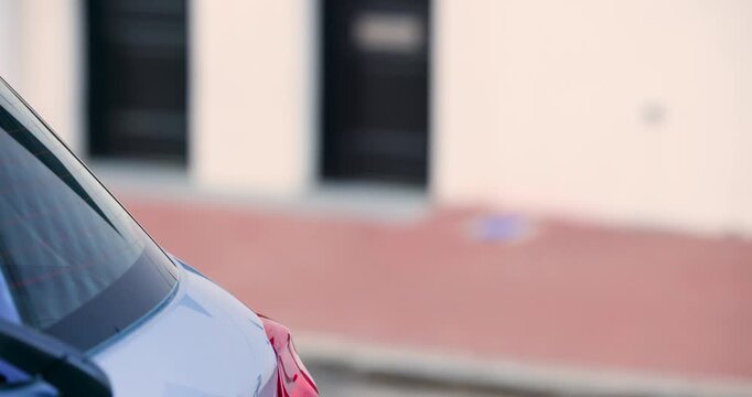 Diverse pedestrians resuming walking on sidewalk past parked car left edge, commuting, copy space