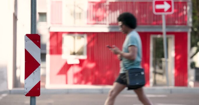 Diverse people crossing after passing car, walking past chevron sign to reach sidewalk, copy space