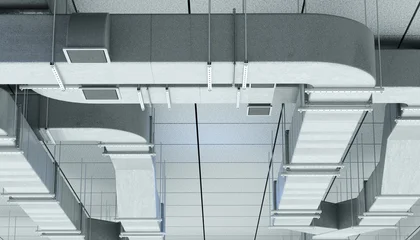 HVAC engineering and building ventilation installation. Air ducts and climate control systems mounted under ceiling, supporting air circulation, temperature regulation and facility maintenance. © Grispb
