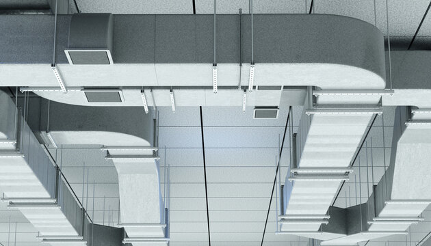 HVAC engineering and building ventilation installation. Air ducts and climate control systems mounted under ceiling, supporting air circulation, temperature regulation and facility maintenance.