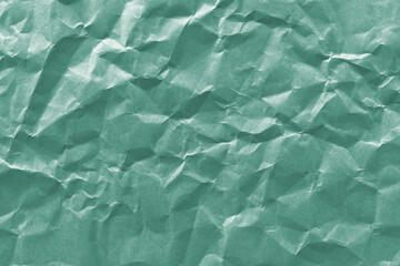 Obraz premium Textured green crumpled paper background