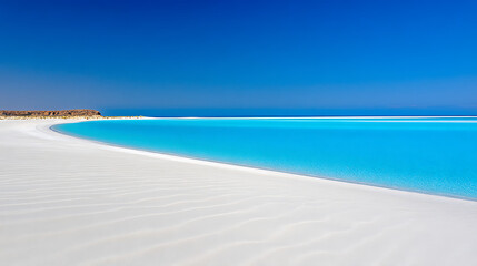 Fototapeta premium A beautiful beach with a blue ocean and white sand