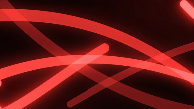 Abstract red light trails on black background with bright glowing intersections for technology, energy, and motion design.
