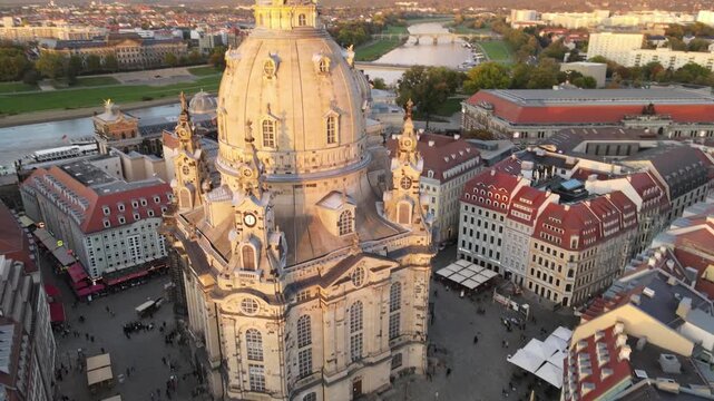 Drone rises above the square and tilts up along the Frauenkirche facade.