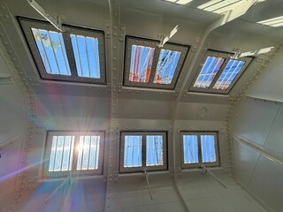 Majestic view of the tall ship Kaiwo Maru and Shinminato Bridge against the snowy Tateyama Mountains in Toyama, Japan.