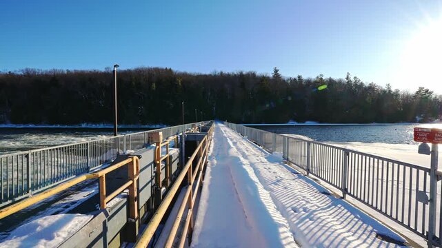 Snow Covered Walkway Bridge Over the Trent River in Frankford Ontario Canada During Winter