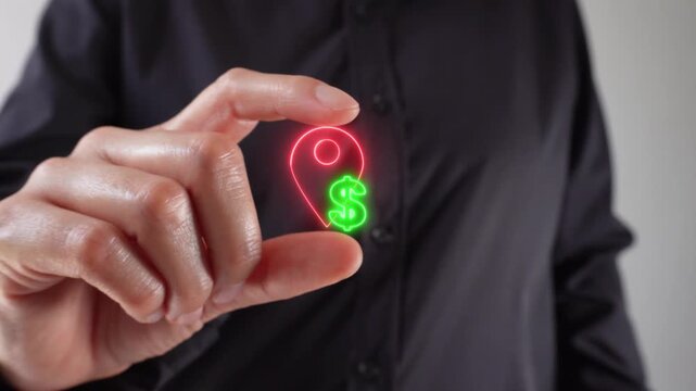 Economic value by location. Close-up of a woman's hands holding a virtual location pin icon with a dollar sign between her two fingers.