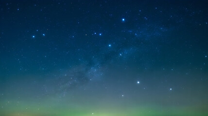 Fototapeta premium Starry night sky with glowing stars and soft clouds in a deep blue cosmic atmosphere