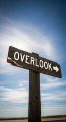 Fototapeta premium Rustic Overlook Sign Invites Exploration Under Vast Blue Sky