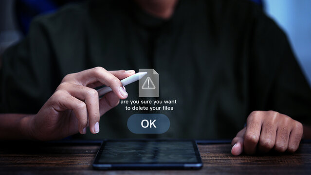 Data Deletion Warning Interface with Stylus and Tablet Cyber Security Concept