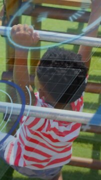 Vertical video: Boy gripping low bar, pulling along bars for play, overlays reflecting on panel