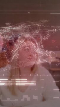 Vertical video: Stylist approaching client, styling hair for salon as HUD map and graphs overlaying
