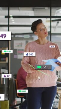 Vertical video: Woman holding folder watching floating notifications, tracking social metrics rise