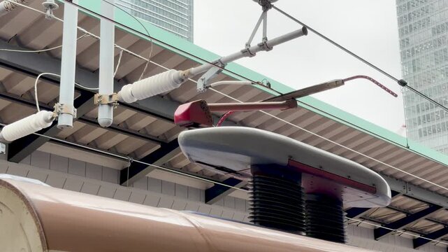 Close Up of a High Speed Train Pantograph at Tokyo Station