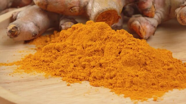 Turmeric powder in a cup.