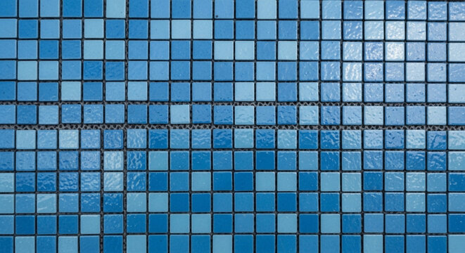 Grid pattern of small, square ceramic mosaic tiles in various shades of blue and cyan, commonly used for swimming pools or bathrooms.